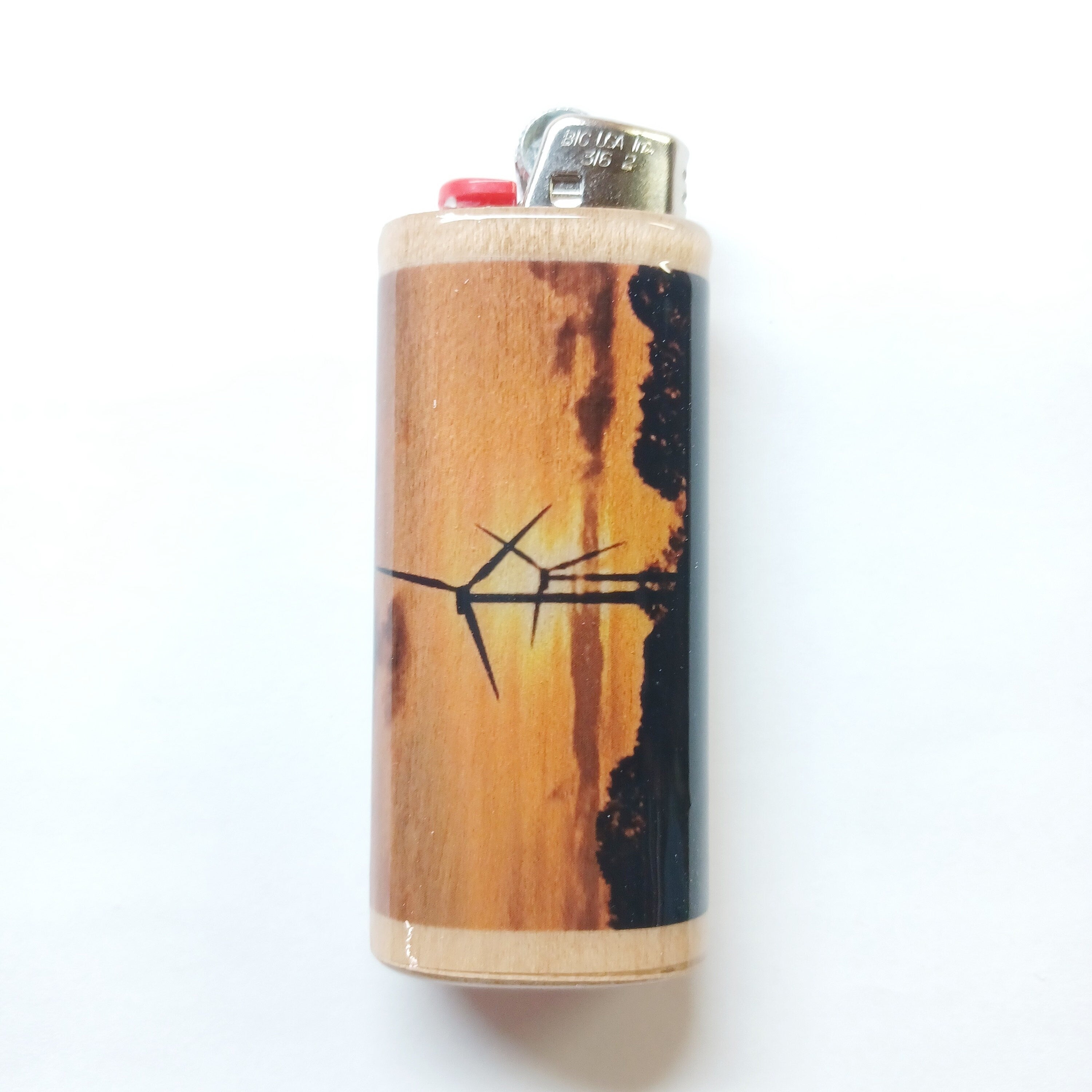 Wooden lighter with black design on a white background