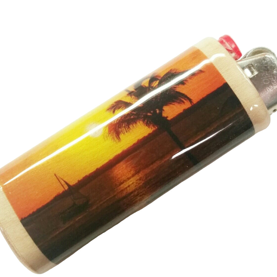 Lighter with a sunset and palm tree design on a white background