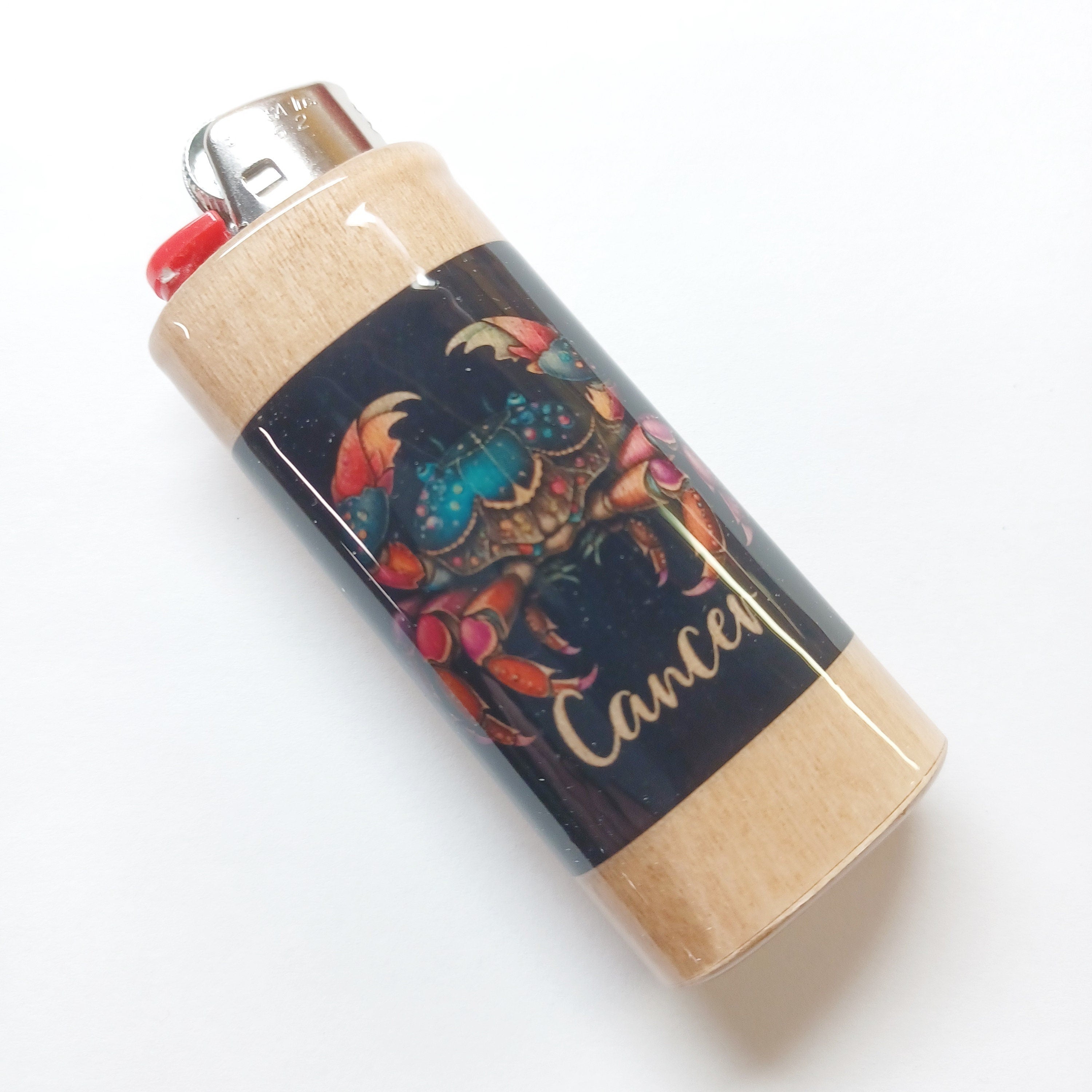 Lighter with a colorful design and 'Cancer' text on a white background