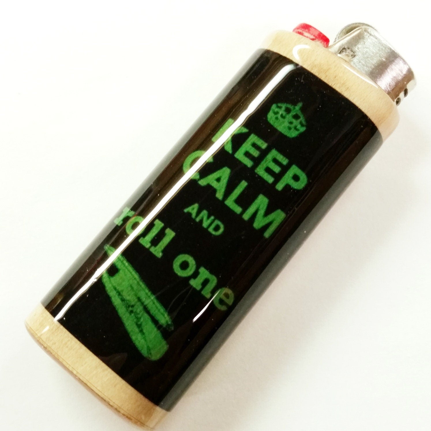 Lighter with 'Keep Calm and Roll One' text on a white background