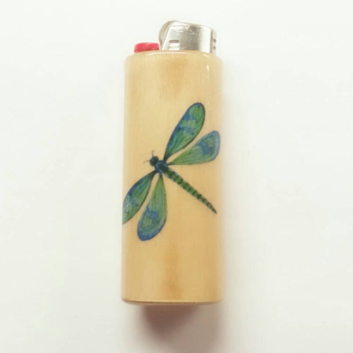 Lighter with a dragonfly design on a white background