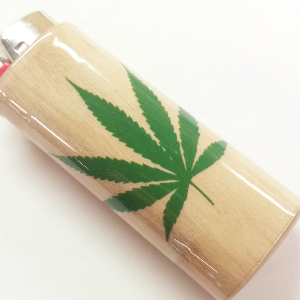 Lighter with a green cannabis leaf design on a white background