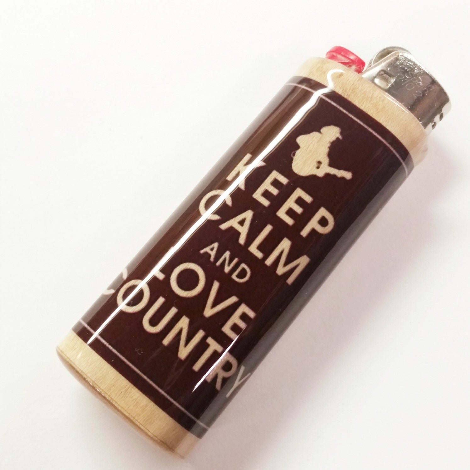 Lighter with 'Keep Calm and Love Country Music' text on a white background
