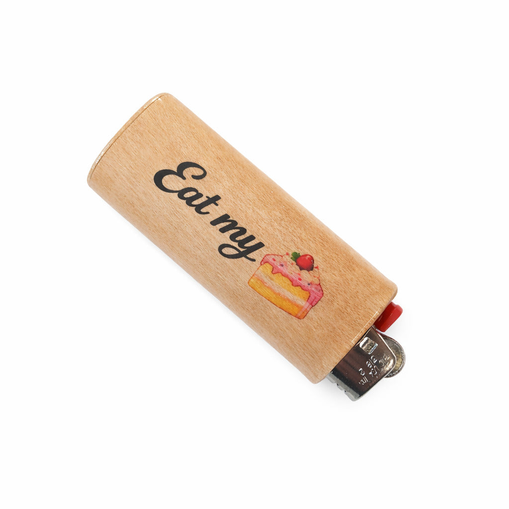 Wooden lighter with 'Eat my' and cake illustration on a white background