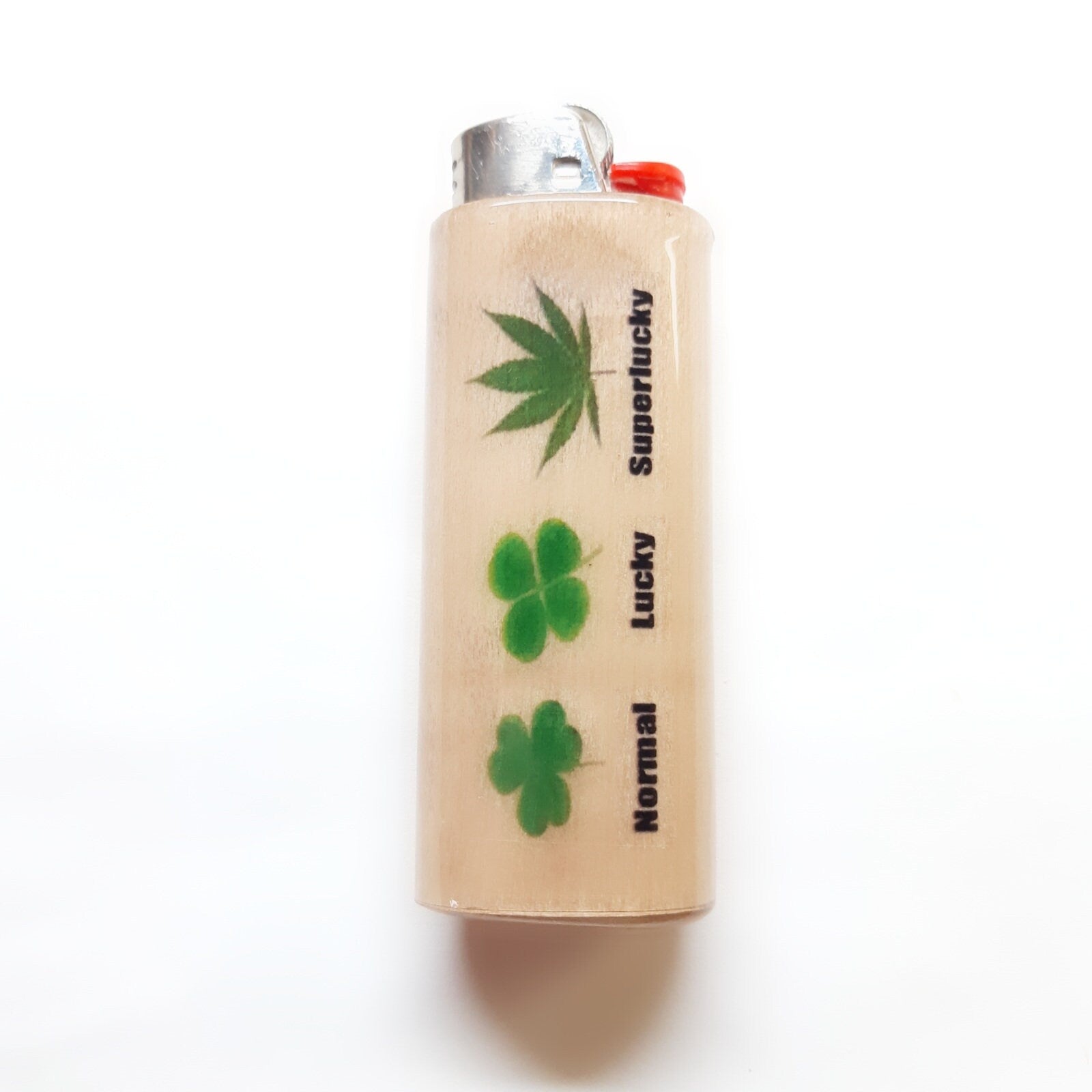 Lighter with cannabis leaf and four-leaf clover designs on a white background