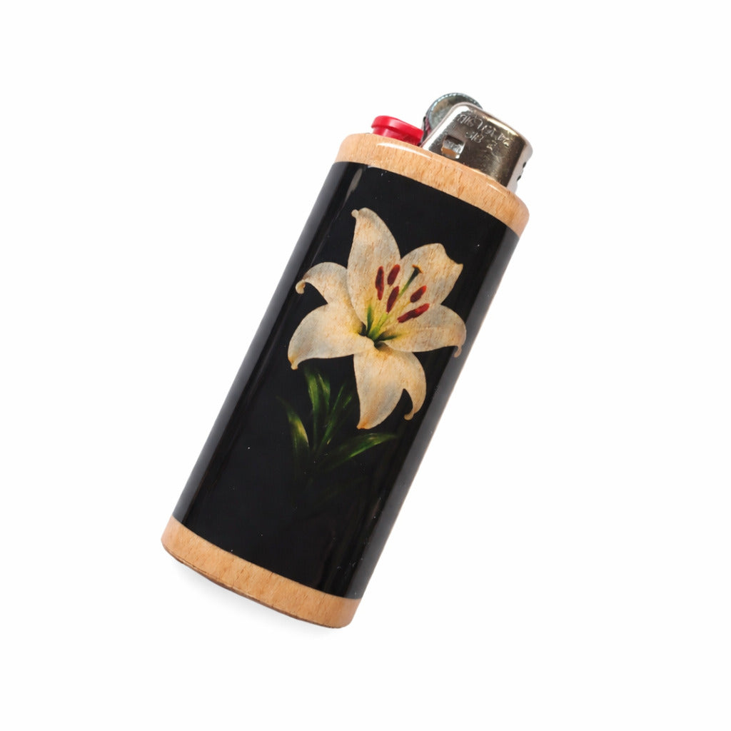 Lighter with a white flower design on a black background