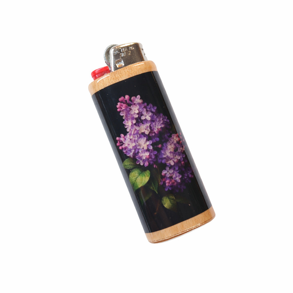 Lighter with a lilac floral design on a black background